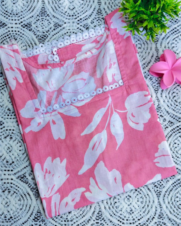 IMG_20260405_113556853 Pink Top with Striking White Flower Prints