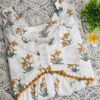 IMG_20260405_115005482 White cotton peplum top with yellow daffodil print