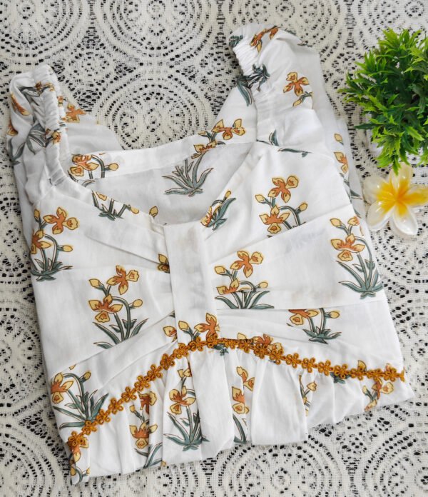 IMG_20260405_115005482 White cotton peplum top with yellow daffodil print