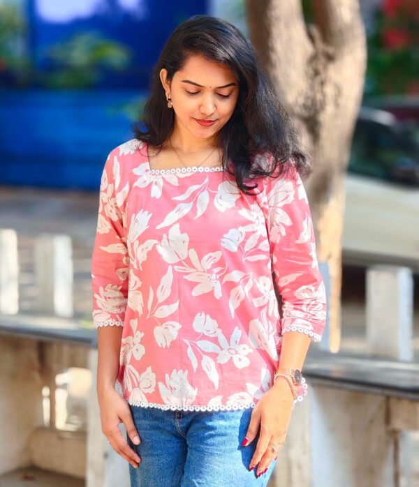 IMG_20260428_082725841 (1) Pink Top with Striking White Flower Prints