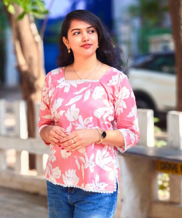 IMG_20260428_082923255 (1) Pink Top with Striking White Flower Prints