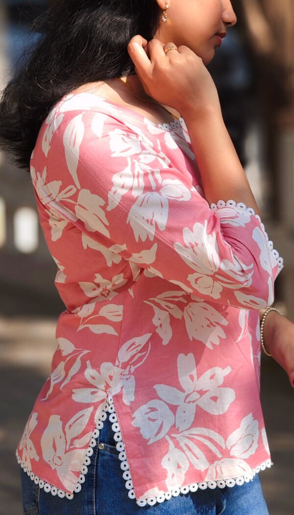 IMG_20260428_083242521_2 Pink Top with Striking White Flower Prints